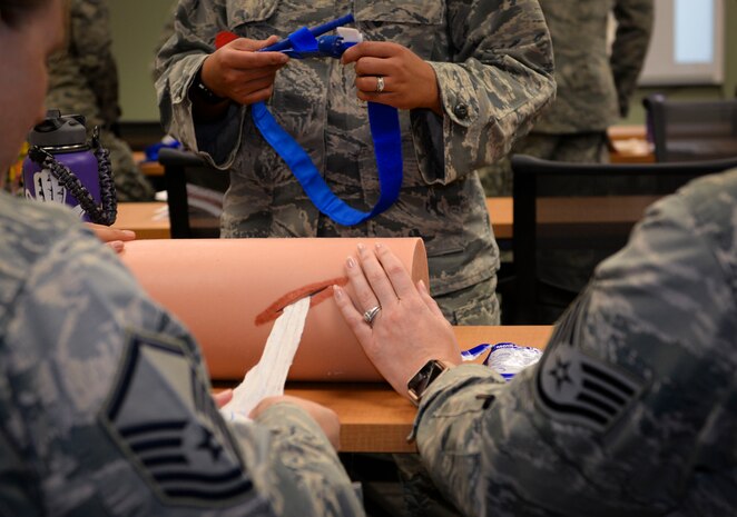 Master Sgt. Vaulta Hanni, 377th Medical Operations Squadron medical technician, and Staff Sgt. Kelly Alvarez, 99 Aerospace Medical Squadron aerospace medical technician, practice Stop the Bleed techniques at Mike O’Callaghan Military Medical Center on Nellis Air Force Base, Nevada, June 22, 2018. Stop the Bleed is a course designed to train and empower bystanders to help in a bleeding emergency before professional help arrives. (U.S. Air Force Photo by Airman Bailee A. Darbasie)