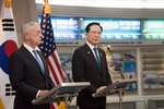 Defense Secretary James N. Mattis and the South Korean defense minister speak from behind podiums.