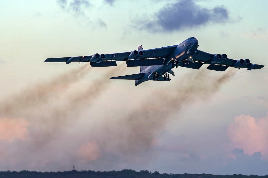 An aircraft lifts up from the ground.