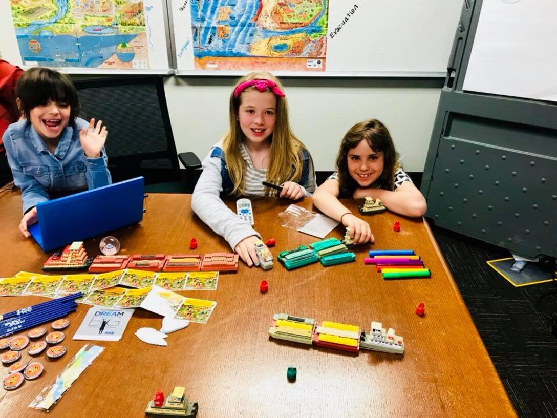 Felicity Maynor, Abby Dinges, and Lilly Redican having fun with the barge models