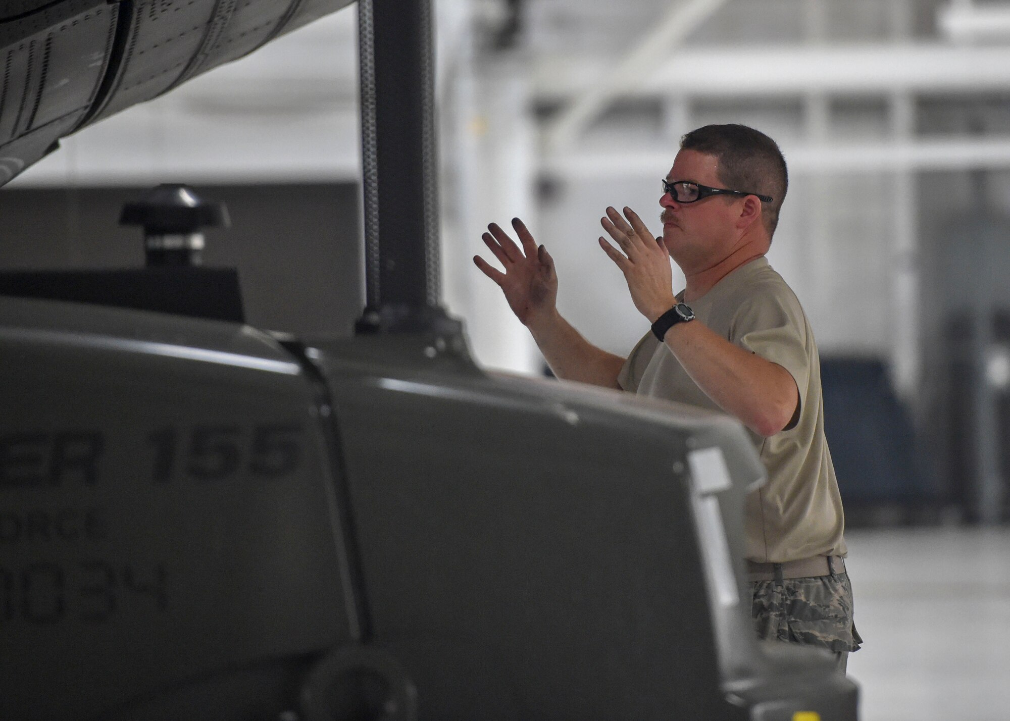 Reserve Citizen Airman Master Sgt. Dan Scott, aircraft maintenance craftsman with the 910th Aircraft Maintenance Squadron, directs a forklift into place by the wing of a C-130H Hercules aircraft here, June 13, 2018.