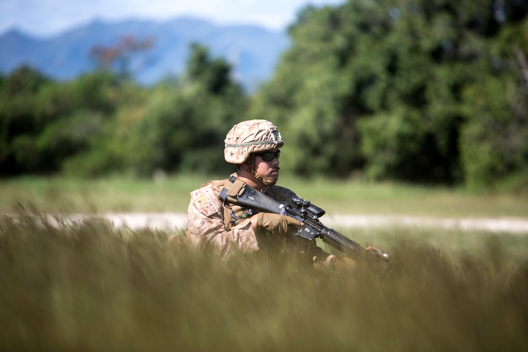 U.S. Marine Corps Lance Cpl. Joseph Manzie, combat engineer with Marine Rotational Force Darwin, provides security during patrol sweeps at Koumac, New Caledonia, May 20, 2018. Sweeps are typically conducted to search for materials in the ground that may be used against friendly forces or be of intelligence value. “Being a CE is that my job is so versatile,” said Manzie. “I have to ability to perform actions that can change the battlespace, such as breaching, sweeping, or engineer reconnaissance.”