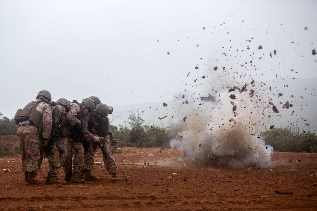 U.S. Marines Corps Combat Engineers with Marine Rotational Force Darwin, detonate an oval charge during a breach at Plum, New Caledonia, May 16, 2018. As a Combat Engineer, performing a breach is an objective that can be tasked if necessary. Their capabilities are both constructive, e.g., building bunkers, providing utilities and destructive, e.g., demolition and breaching support capabilities to the battlefield. This unique combination of capabilities provides knowledge, experience and skills to commanders at the operational and tactical levels with which they can, according to Marine Corps Warfighting Publication 3-34, reduce friction, facilitate maneuver and improve the morale of friendly forces or create friction and disorder for the enemy.