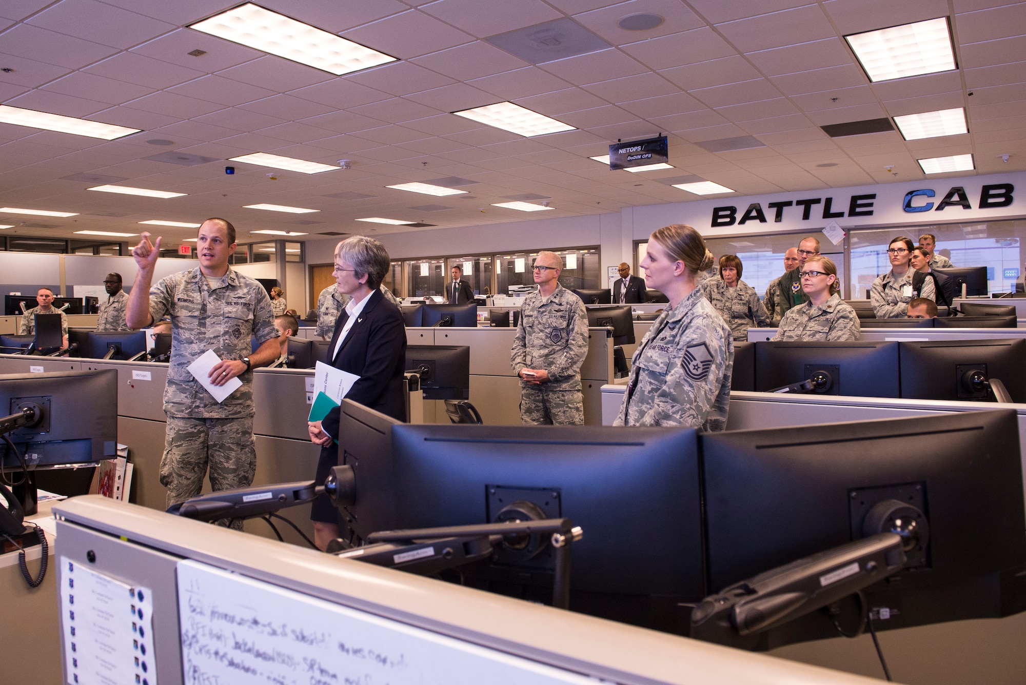 Capt. Benjamin Wiemers, 624th Operations Center plans chief, explains the 624th OC mission to Secretary of the Air Force Heather Wilson during her visit to Joint Base San Antonio-Lackland, Texas, June 28, 2018. During her visit, Wilson met Air Forces Cyber Airmen and learned about their contributions to the cyber mission. (U.S. Air Force photo by Tech. Sgt. R.J. Biermann)