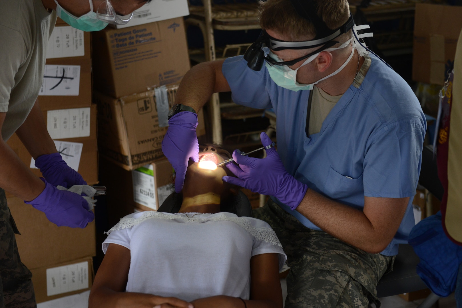 A Salvadoran girl gets dental care during a medical readiness training exercise June 24, 2018, at Centro Escolar Canton La Esperanza de Olocuilta, El Salvador. The MEDRET is part of U.S. Army South-led Beyond the Horizon exercise lasting May 12 through August 4. The exercise involves about 1,800 Soldiers of all components, part of Combined Joint Task Force Hope and includes MEDRETS and construction of schools and a clinic addition.