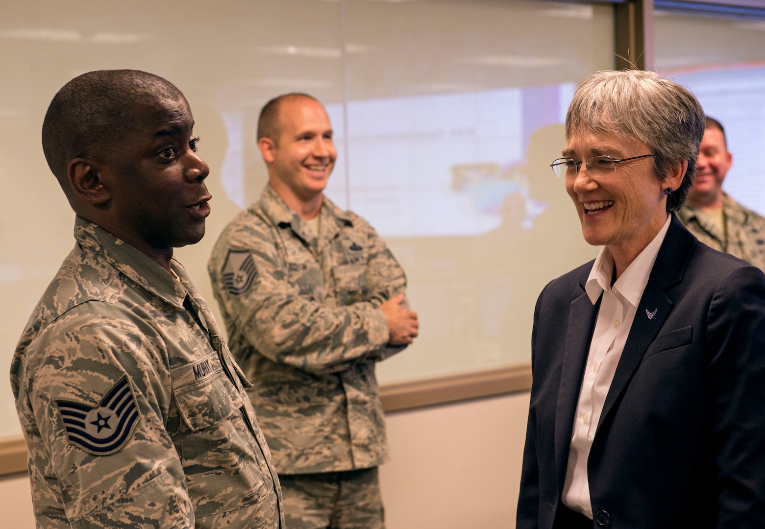 Tech. Sgt. Bruce Murray, 624th Operations Center defensive cyber operator, shares a joke with Secretary of the Air Force Heather Wilson during her visit to Joint Base San Antonio-Lackland, Texas, June 28, 2018. During her trip, Wilson met Air Forces Cyber Airmen and learned about their contributions to the cyber mission. (U.S. Air Force photo by Tech. Sgt. R.J. Biermann)