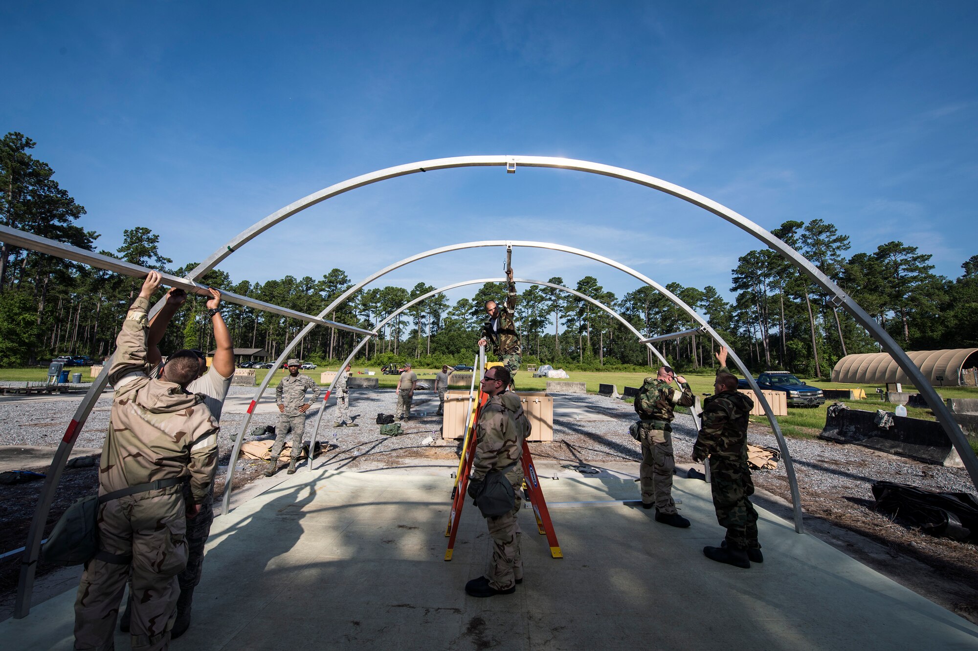 Airmen from the 23d Civil Engineer Squadron, build an Alaskan Small Shelter System during a Chemical, Biological, Radiological, Nuclear and Explosive (CBRNE) Olympics, June 21, 2018, at Moody Air Force Base, Ga. Moody held its first CBRNE Olympics to further Airmen’s overall knowledge on all of the aspects of CBRNE through a new method that was meant to establish a sense of competition and camaraderie. (U.S. Air Force photo by Airman 1st Class Eugene Oliver)