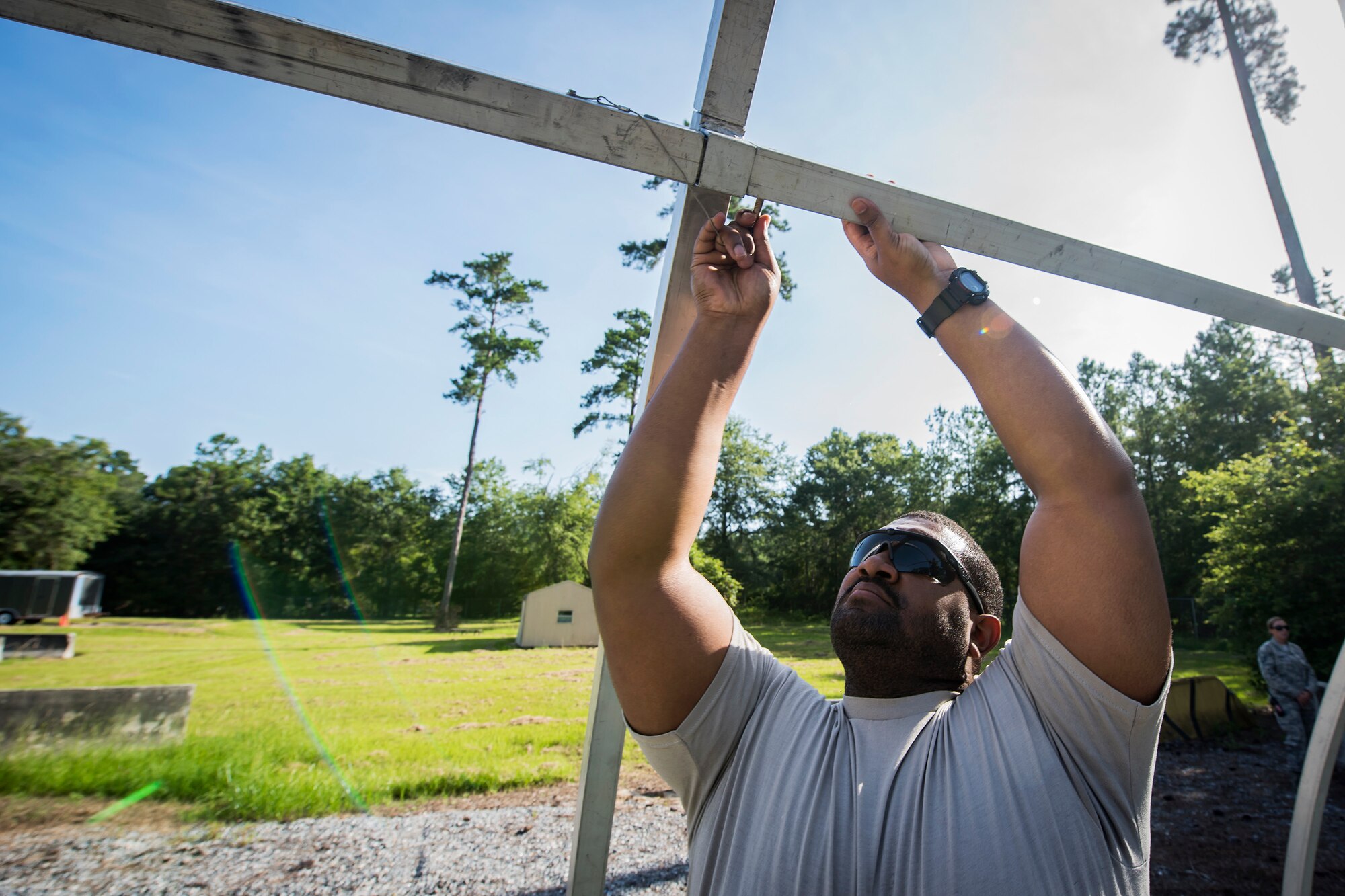 Capt. William Bush, 23d Civil Engineer Squadron project program manager, attaches a railing during a Chemical, Biological, Radiological, Nuclear and Explosive (CBRNE) Olympics, June 21, 2018, at Moody Air Force Base, Ga.  Moody held its first CBRNE Olympics to further Airmen’s overall knowledge on all of the aspects of CBRNE through a new method that was meant to establish a sense of competition and camaraderie. (U.S. Air Force photo by Airman 1st Class Eugene Oliver)