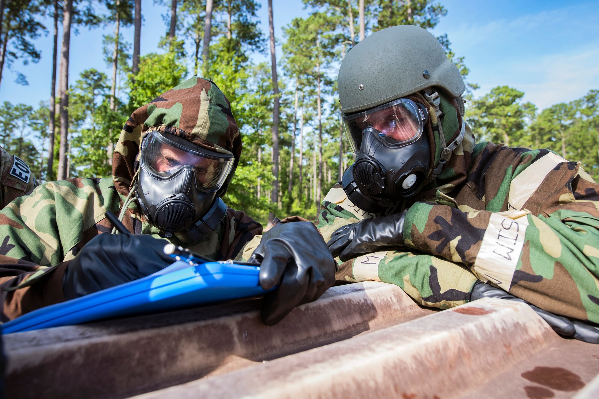 Airmen from the 23d Civil Engineer Squadron, take notes during a chemical, Biological, Radiological, Nuclear and Explosive (CBRNE) Olympics, June 21, 2018, at Moody Air Force Base, Ga.   Moody held its first CBRNE Olympics to further Airmen’s overall knowledge on all of the aspects of CBRNE through a new method that was meant to establish a sense of competition and camaraderie. (U.S. Air Force photo by Airman 1st Class Eugene Oliver)