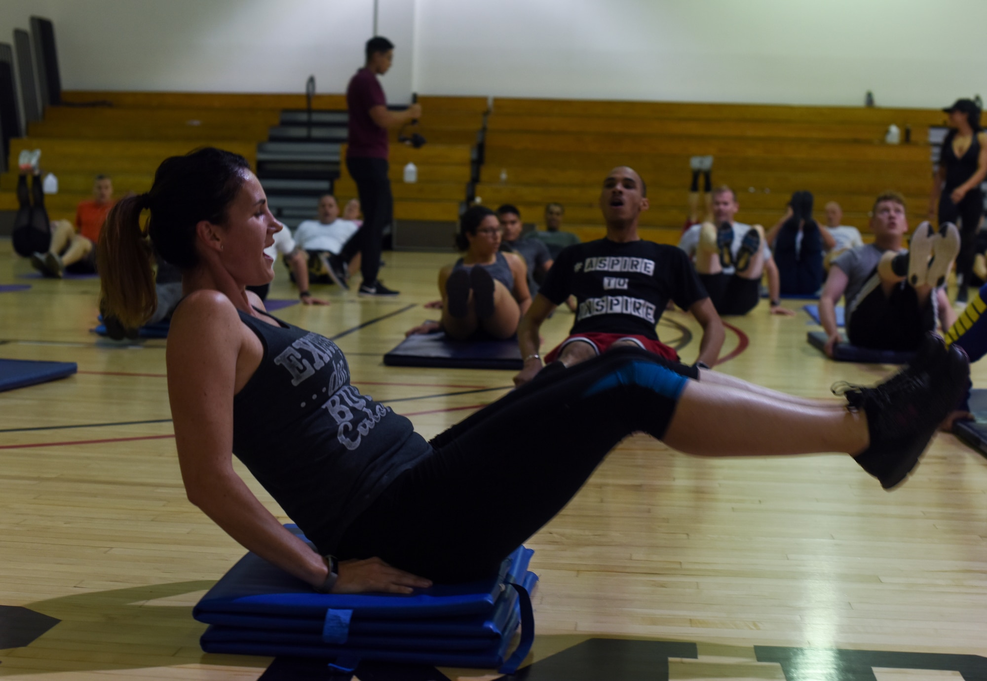 Joint Base McGuire-Dix-Lakehurst community members exercise during the Fit for the Fight professional development event at the McGuire Fitness Center on Joint Base MDL, N.J., June 27, 2018. Community members joined Elise "The Diva Chef" Harris, National Academy of Sports Medicine nutrition specialist, in her two-day demonstration of exercising, cooking and nutrition classes. (U.S. Air Force photo by Airman Ariel Owings)