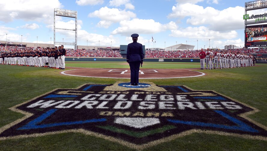 Airman 1st Class Aliyah Richling stands at home-plate after singing the national anthem at the National Collegiate Athletic Association Men’s College World Series game at TD Ameritrade Park Omaha, Nebraska, June 26, 2018.