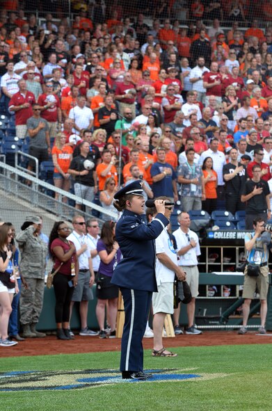 Airman 1st Class Aliyah Richling sings the national anthem at the National Collegiate Athletic Association Men’s College World Series game at TD Ameritrade Park Omaha, Nebraska, June 26, 2018.