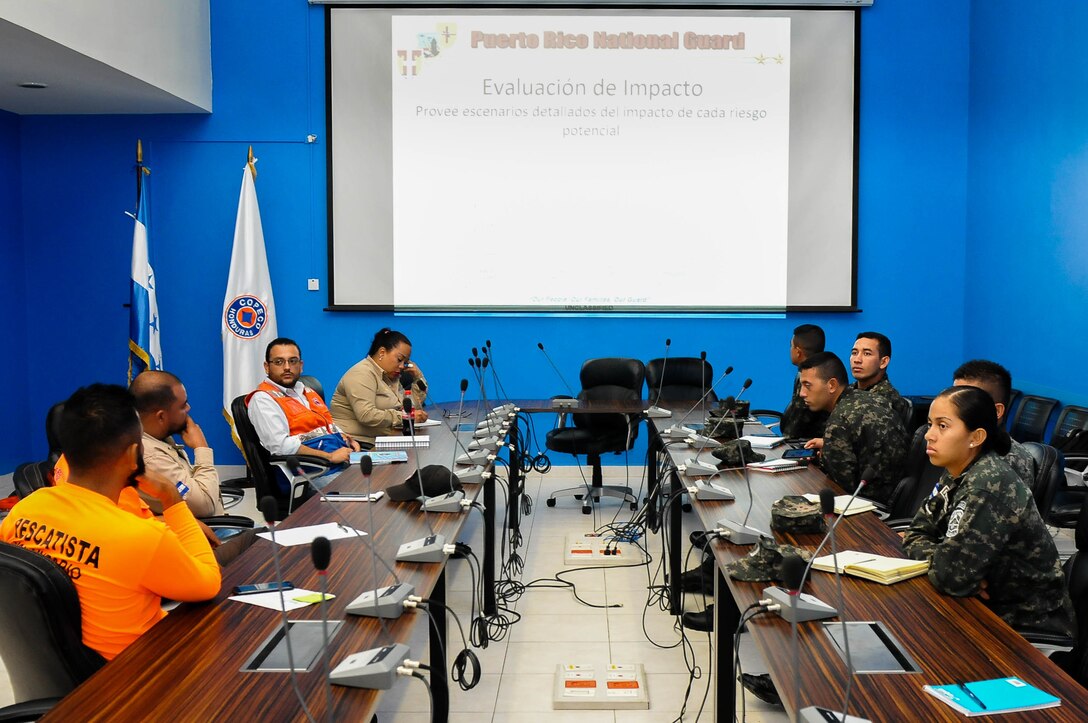 Officers of the Puerto Rico National Guard visit the Honduras Emergency Operation Center