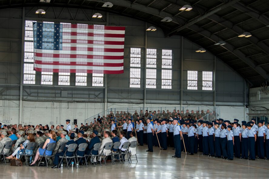 Members of Team MacDill observe the 6th Air Mobility Wing (AMW) change of command ceremony in Hangar 3 at MacDill Air Force Base, Fla., June 29, 2018.