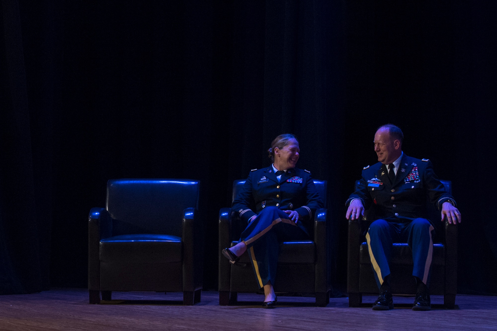 From left, U.S. Army Cols. Jennifer S. Walkawicz,733rd Mission Support Group incoming commander, and Ralph L. Clayton, 733rd MSG outgoing commander, share a laugh during a change of command ceremony at Joint Base Langley-Eustis, Va., June 29, 2018.