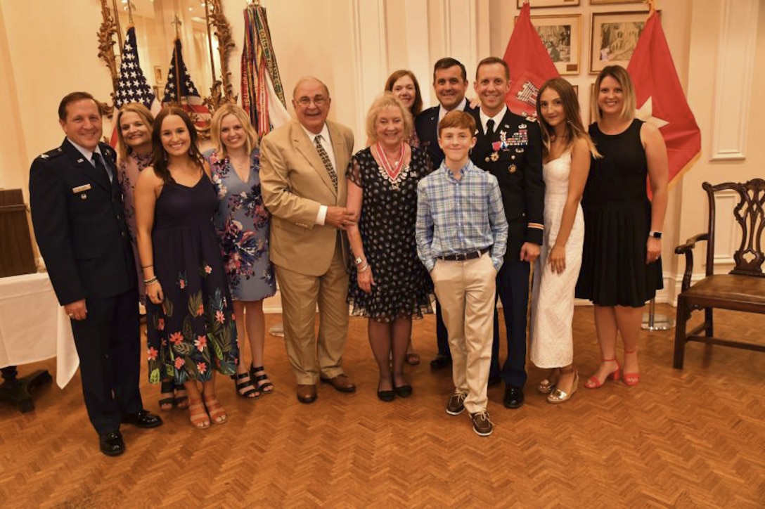 Colonel James A. DeLapp and his family pose for a photo following his retirement dinner June 28, 2016 at the Athelstan Club in Mobile, Al. DeLapp retired after 24 years of service to the U.S. Army Corps of Engineers and the U.S. Army.