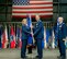 Col. Parker H. Wright accepts the National Air and Space Intelligence Center’s guidon from Lt. Gen. VeraLinn Jamieson Deputy Chief of Staff for Intelligence, Surveillance and Reconnaissance, Headquarters U.S. Air Force, during the change of command ceremony at the U.S. Air Force Museum, June. 29. (U.S. Air Fore photo/Senior Airman Samuel Earick)