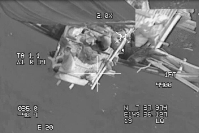 A back and white photo showing rescue operations in the Pacific Ocean.