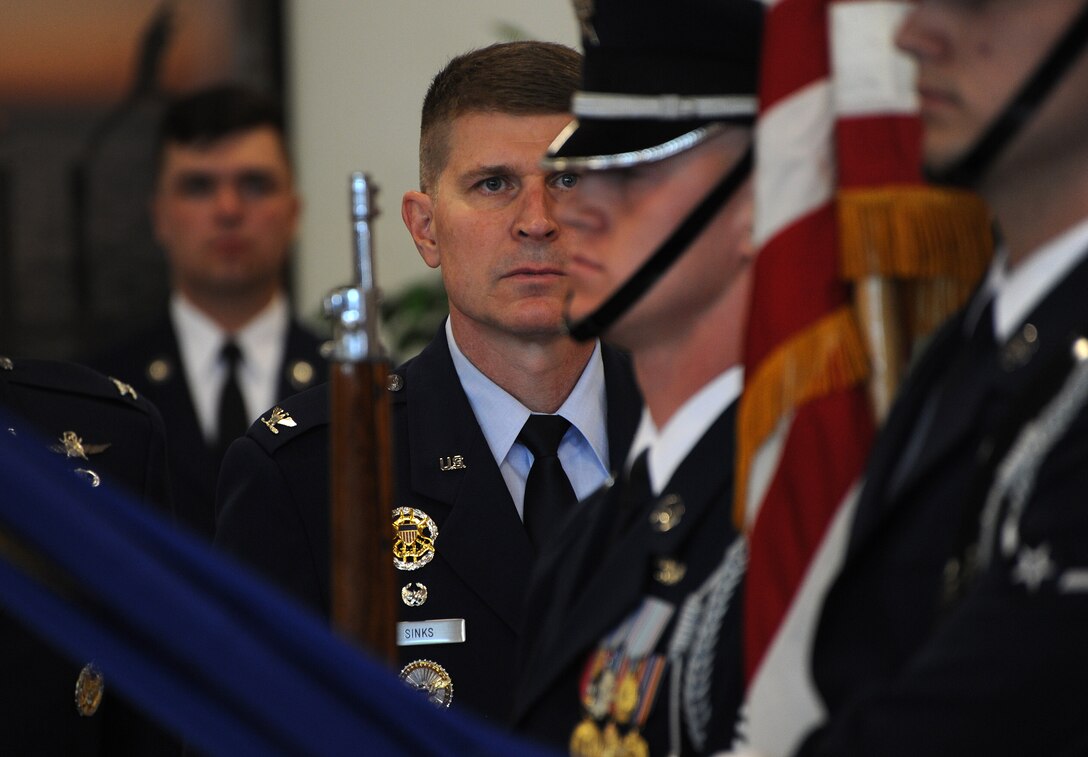 Col. Michael A. Sinks assumes command of the 844th Communications Group during a change-of-command ceremony June 28 on Joint Base Andrews, Maryland.