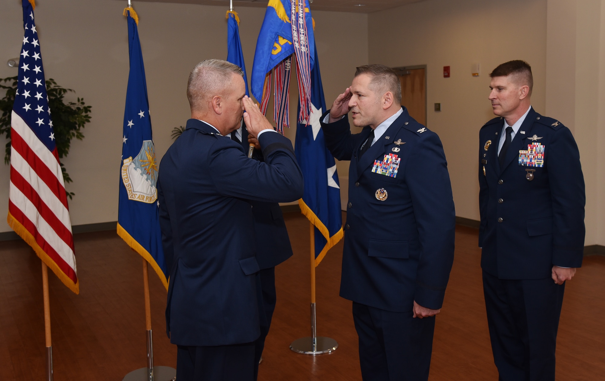 Col. Rocky A. Favorito relinquishes command of the 844th Communications Group to Maj. Gen. James A. Jacobson, Air Force District of Washington commander, during a ceremony June 48 on Joint Base Andrews, Maryland