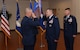 Col. Rocky A. Favorito relinquishes command of the 844th Communications Group to Maj. Gen. James A. Jacobson, Air Force District of Washington commander, during a ceremony June 48 on Joint Base Andrews, Maryland