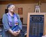 Debra Cain, director of the Minneapolis Armed Forces Services Center, views the plaque that bears her name as the newest member of the Order of the Global Vikings. (Air Force Photo/Paul Zadach)