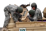 An instructor with the Idaho Army National Guard’s 204th Regiment (Regional Training Institute), right, looks on as students prepare an M1 Abrams tank for a training evolution at Gowen Field, Idaho. Located in every state and part of the One Army School System, the Army National Guard-run regional training institutes provide training on a variety of subjects ranging from leadership courses needed for promotion to functional training on specific systems, equipment and procedures as well as courses for those transitioning to a new military operational specialty.