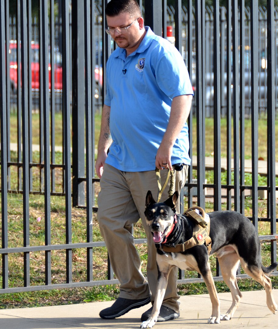 Ryan Kaono, a support agreement manager with the Air Force Installation and Mission Support Center, takes his service dog Romeo for a walk around his work center. Thanks to Romeo, Kaono is able to quickly transition through bouts of anxiety and night terrors.