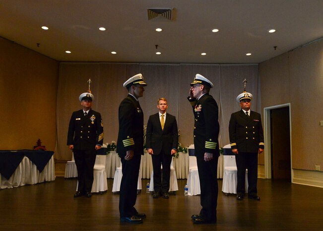 U.S. Navy Capt. Robert Hudson, right, salutes U.S. Navy Capt. Kevin Byrne, Joint Base Charleston deputy commander, as he requests to go to shore for the last time as part of his retirement ceremony June 29, 2018 at the Joint Base Charleston Weapons Station Red Bank Club.
