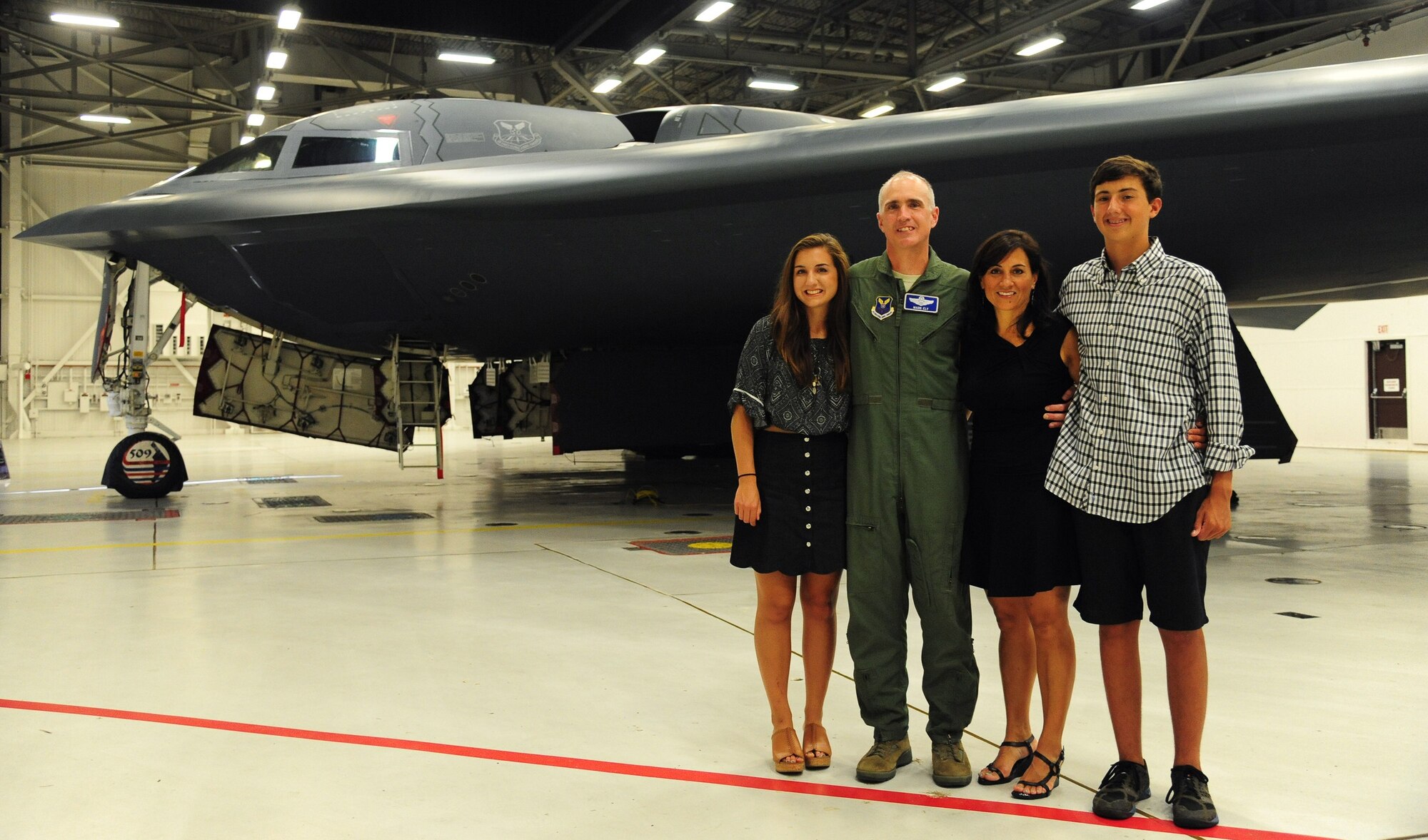 U.S. Air Force Col. Mark Ely, the 509th Bomb Wing vice commander, and his wife Alison, and their children, Leah and Andrew, in front of a B-2 Spirit at Whiteman Air Force Base, Missouri, Aug. 22, 2016. Ely has served in the Air Force for 26 years and he is a command pilot with more than 3,530 flying hours, including more than 200 combat hours.