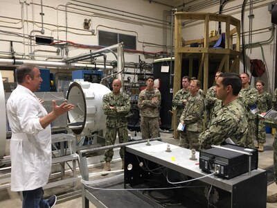 Joint Service Diving Officers Course participants toured Naval Surface Warfare Center Panama City Division on June 29, 2018. The Diving Officer course trains Navy Explosive Ordnance Disposal, Engineering Duty Officers, Civil Engineer Corps Officers, Army Engineer, and Coast Guard Officers in supervision and diving techniques for surface supplied air and mixed gas, SCUBA, and closed circuit operations. U.S. Navy Photo by Susan H. Lawson.