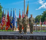 Lt. Gen. Jeffrey Buchanan (center), Maj. Gen. William Hall (left) and Maj. Gen. Richard Gallant (right) participate in the Joint Task Force Civil Support (JTF-CS) Change of Command ceremony on June 29 at Seay Plaza on Fort Eustis. During the ceremony, Hall assumed command of JTF-CS from Gallant and became the tenth commander of JTF-CS. JTF-CS provides command and control for designated Department of Defense specialized response forces to assist local, state, federal and tribal partners in saving lives, preventing further injury and providing critical support to enable community recovery. (Official DoD photo by Mass Communication Specialist 3rd Class Michael Redd/released)