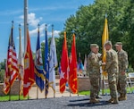 Maj. Gen. Richard Gallant (right), Lt. Gen. Jeffrey Buchanan (center front), Maj. Gen. William Hall (right) and CMSgt James Brown (center back) pass along the Joint Task Force Civil Support (JTF-CS) flag during a Change of Command ceremony on 29 June. The tradition symbolizes the passing of authority from the previous JTF-CS commander (Gallant) to the new commander (Hall), who is now the tenth commander of JTF-CS. JTF-CS provides command and control for designated Department of Defense specialized response forces to assist local, state, federal and tribal partners in saving lives, preventing further injury and providing critical support to enable community recovery. (Official DoD photo by Mass Communication Specialist 3rd Class Michael Redd/released)
