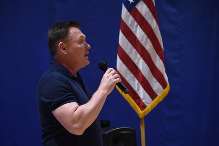 James “Jimmy” Weber, assigned to U.S. Strategic Command‘s (USSTRATCOM) Project Management Office, sings the National Anthem during the inaugural USSTRATCOM Olympics at Offutt Air Force Base, Neb., June 29, 2018.