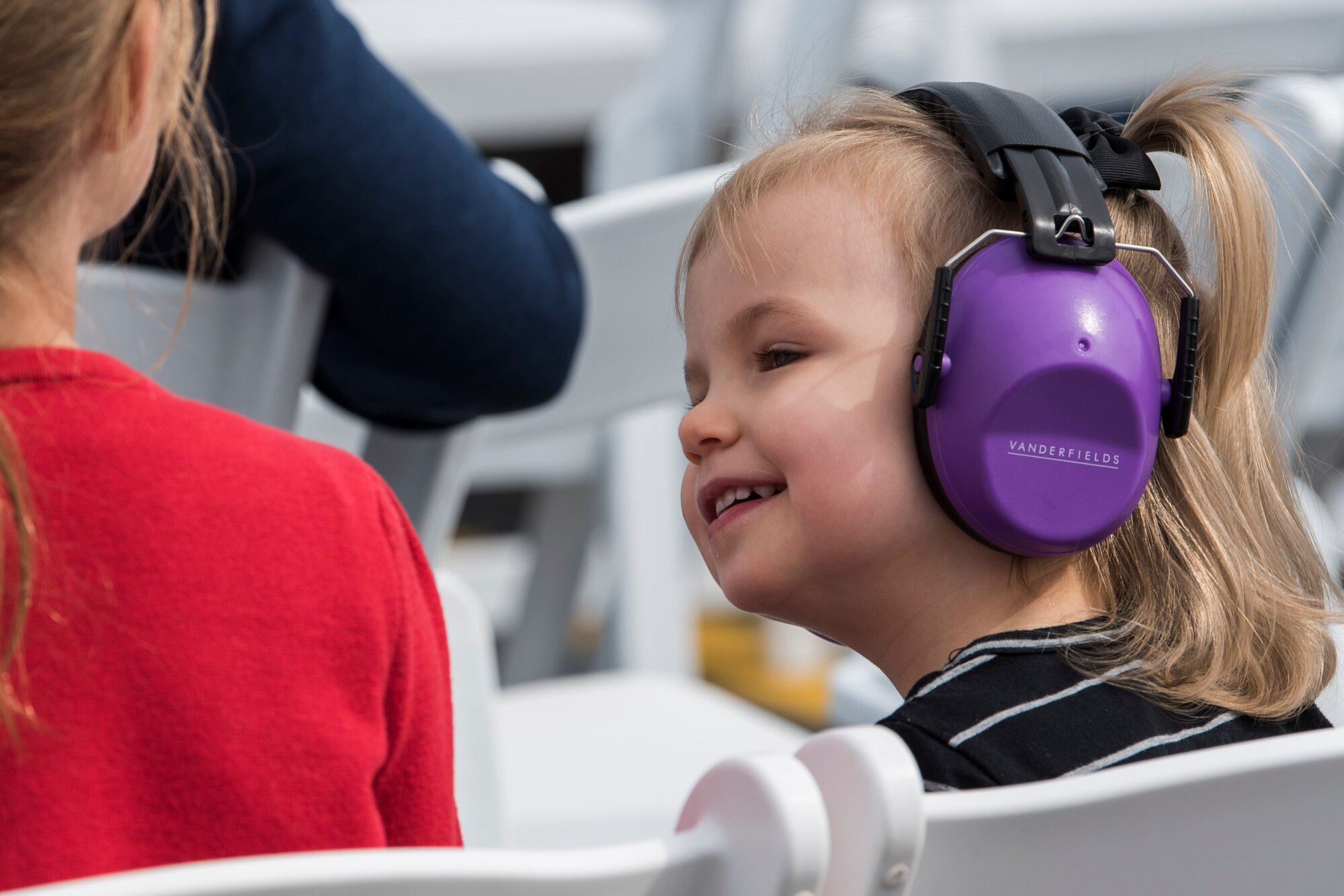 A child enjoys the air show during the Arctic Thunder Open House Special Needs and Department of Defense Family Day at Joint Base Elmendorf-Richardson, Alaska, June 29, 2018. During the biennial open house, JBER opens its gates to the public and hosts multiple performers including the U.S. Air Force Thunderbirds, JBER Joint Forces Demonstration and the U.S. Air Force F-22 Raptor Demonstration Team.