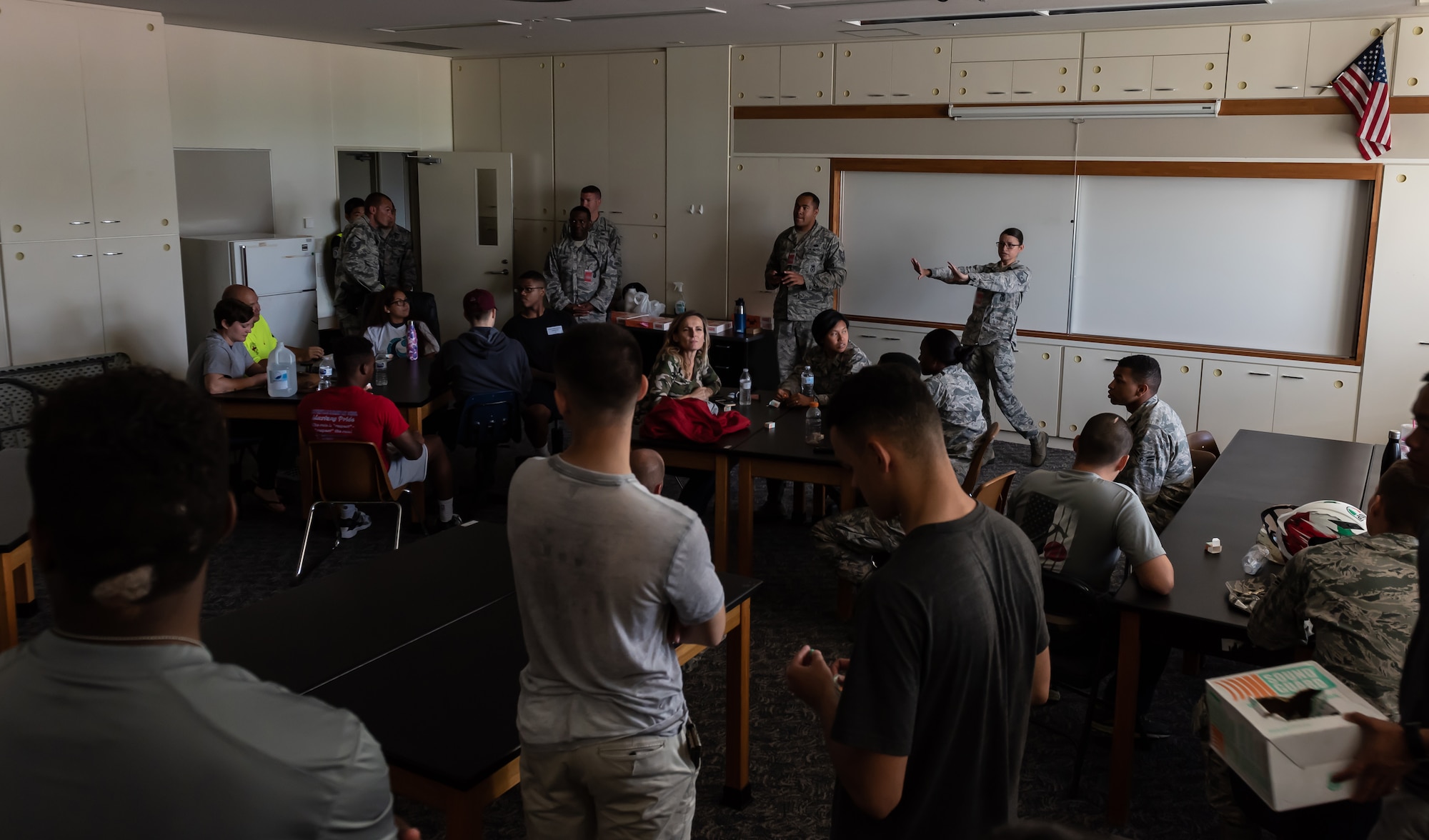 U.S. Air Force Master Sgt. Patricia Vanbeek, 18th Security Forces Squadron NCOIC of training, briefs volunteers for an active shooter exercise about the sequence of events June 25, 2018, at Ryukyu Middle School, Kadena Air Base, Japan. The exercise enabled 18th SFS defenders to work with a U.S. Marine Corps special reaction team and the Kadena Fire Department to hone their skills. (U.S. Air Force photo by Staff Sgt. Micaiah Anthony)
