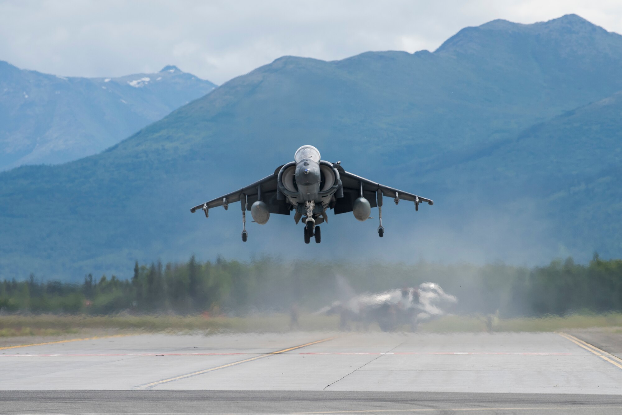 An AV-8B Harrier hovers above the flighline during the Arctic Thunder Open House Special Needs and Department of Defense Family Day at Joint Base Elmendorf-Richardson, Alaska, June 29, 2018. During the biennial open house, JBER opens its gates to the public and hosts multiple performers including the U.S. Air Force Thunderbirds, JBER Joint Forces Demonstration and the U.S. Air Force F-22 Raptor Demonstration Team.