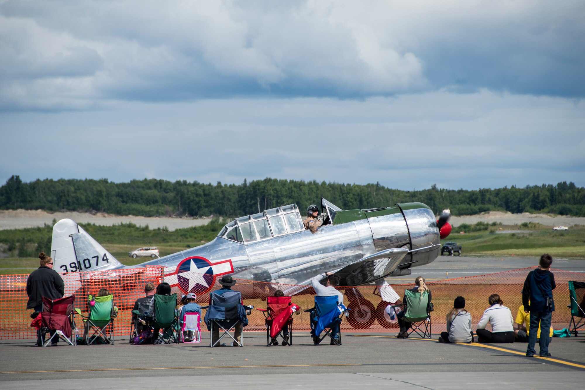 A Commemorative Air Force BT-13 Valiant taxis past spectators during the Arctic Thunder Open House Special Needs and Department of Defense Family Day at Joint Base Elmendorf-Richardson, Alaska, June 29, 2018. During the biennial open house, JBER opens its gates to the public and hosts multiple performers including the U.S. Air Force Thunderbirds, JBER Joint Forces Demonstration and the U.S. Air Force F-22 Raptor Demonstration Team.