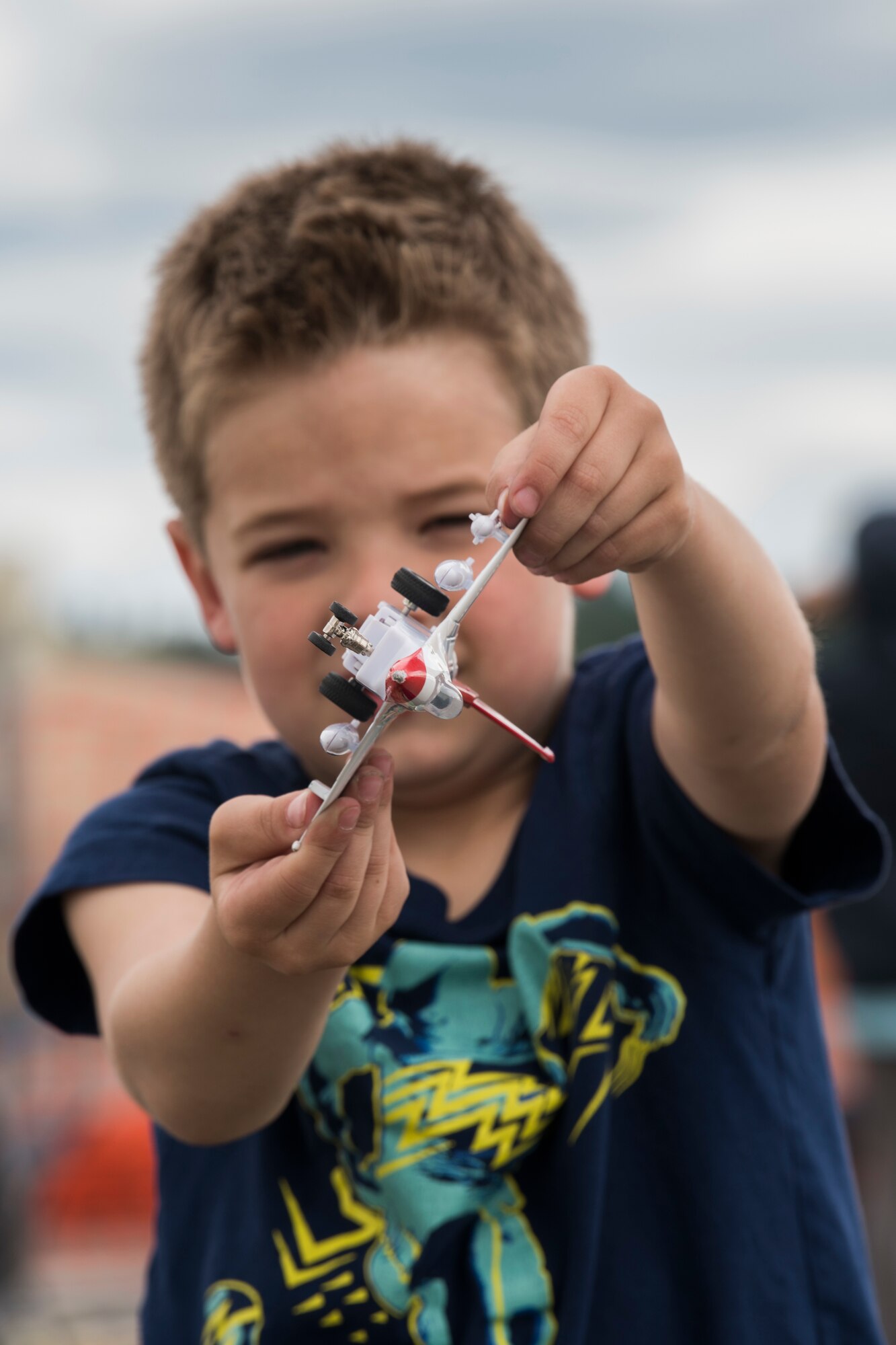 Jacob, 5, son of U.S. Air Force Master Sgt. Christopher Rast, 673d Civil Engineer Squadron, plays with a U.S. Air Force Thunderbird model airplane during the Arctic Thunder Open House Special Needs and Department of Defense Family Day at Joint Base Elmendorf-Richardson, Alaska, June 29, 2018. During the biennial open house, JBER opens its gates to the public and hosts multiple performers including the U.S. Air Force Thunderbirds, JBER Joint Forces Demonstration and the U.S. Air Force F-22 Raptor Demonstration team.