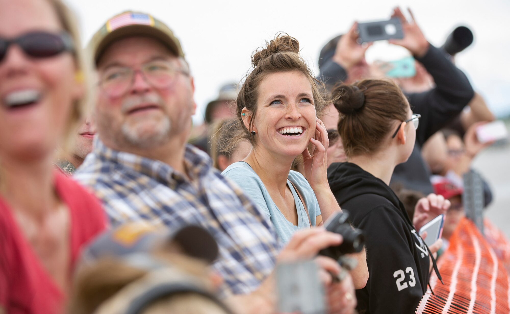 Lora Ramzey smiles during an aerial demonstration during the Special Needs and Department of Defense Family Day at the Arctic Thunder Open House, June 29, 2018. This biennial event hosted by Joint Base Elmendorf-Richardson, Alaska, is one of the largest in the state and one of the premier aerial demonstrations in the world. The event features multiple performers and ground acts to include the JBER joint forces, U.S. Air Force F-22, and U.S. Air Force Thunderbirds demonstrations teams, June 30-July 1.