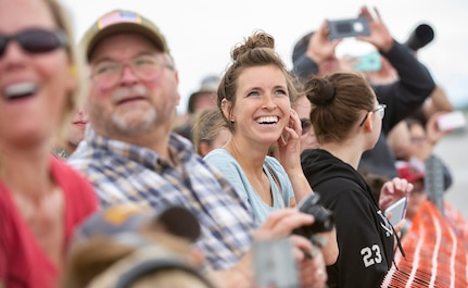 Lora Ramzey smiles during an aerial demonstration during the Special Needs and Department of Defense Family Day at the Arctic Thunder Open House, June 29, 2018. This biennial event hosted by Joint Base Elmendorf-Richardson, Alaska, is one of the largest in the state and one of the premier aerial demonstrations in the world. The event features multiple performers and ground acts to include the JBER joint forces, U.S. Air Force F-22, and U.S. Air Force Thunderbirds demonstrations teams, June 30-July 1.