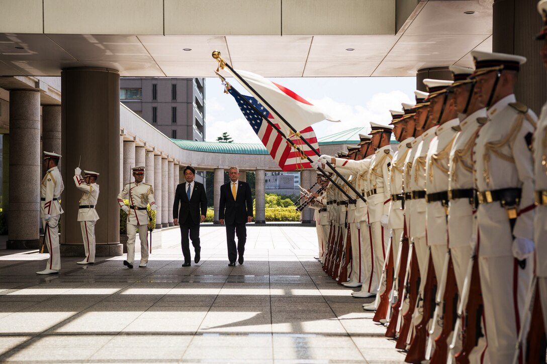 Defense Secretary James N. Mattis walks with Japanese Defense Minister Itsunori Onodera in Tokyo.