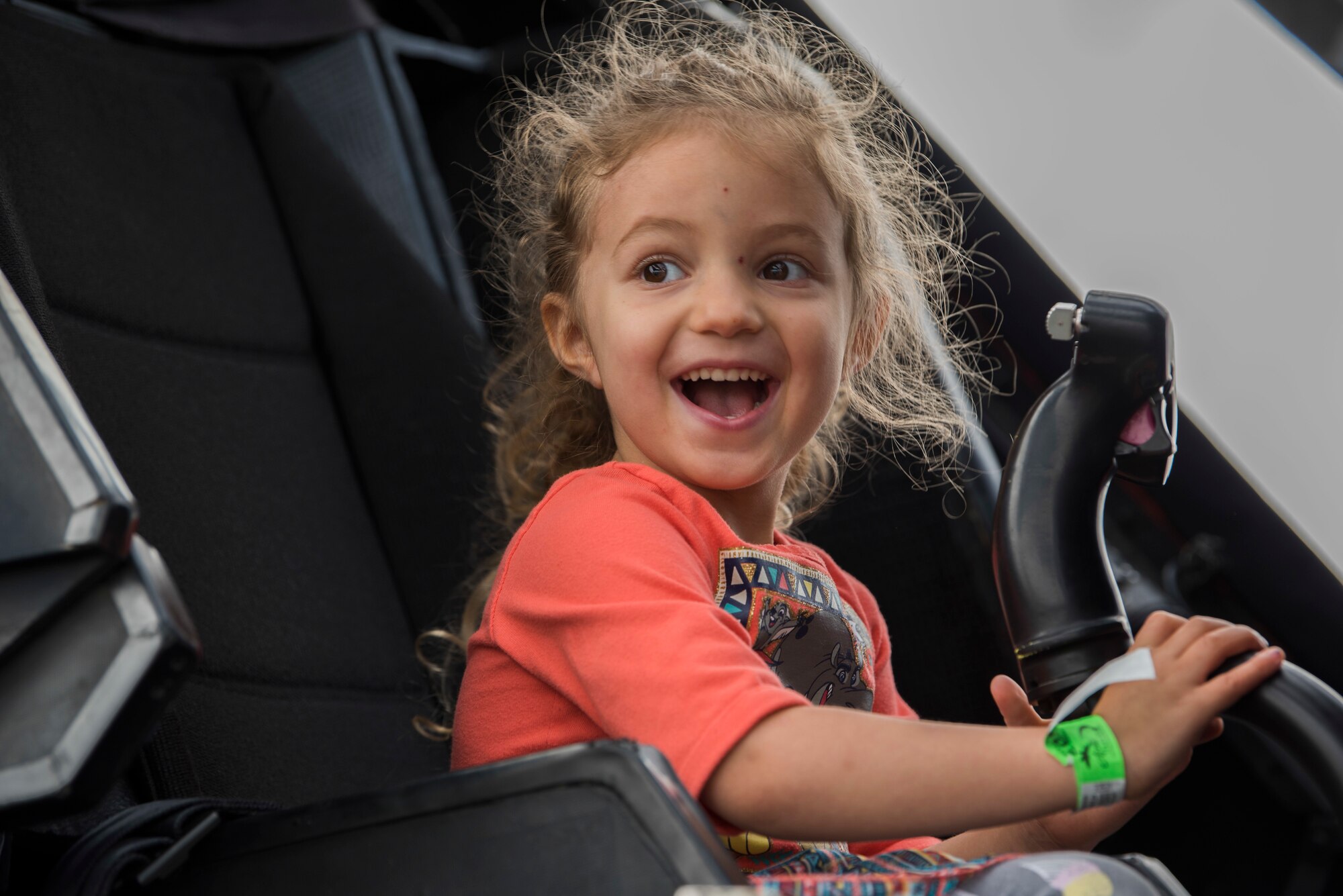 Emily Butcher, 4, sits in a U.S. Army AH-64 Apache attack helicopter during the Arctic Thunder Open House at Joint Base Elmendorf-Richardson, Alaska, June 30, 2018. During the biennial open house, JBER opens its gates to the public and hosts multiple performers including the U.S. Air Force Thunderbirds, JBER Joint Forces Demonstration and the U.S. Air Force F-22 Raptor Demonstration Team.