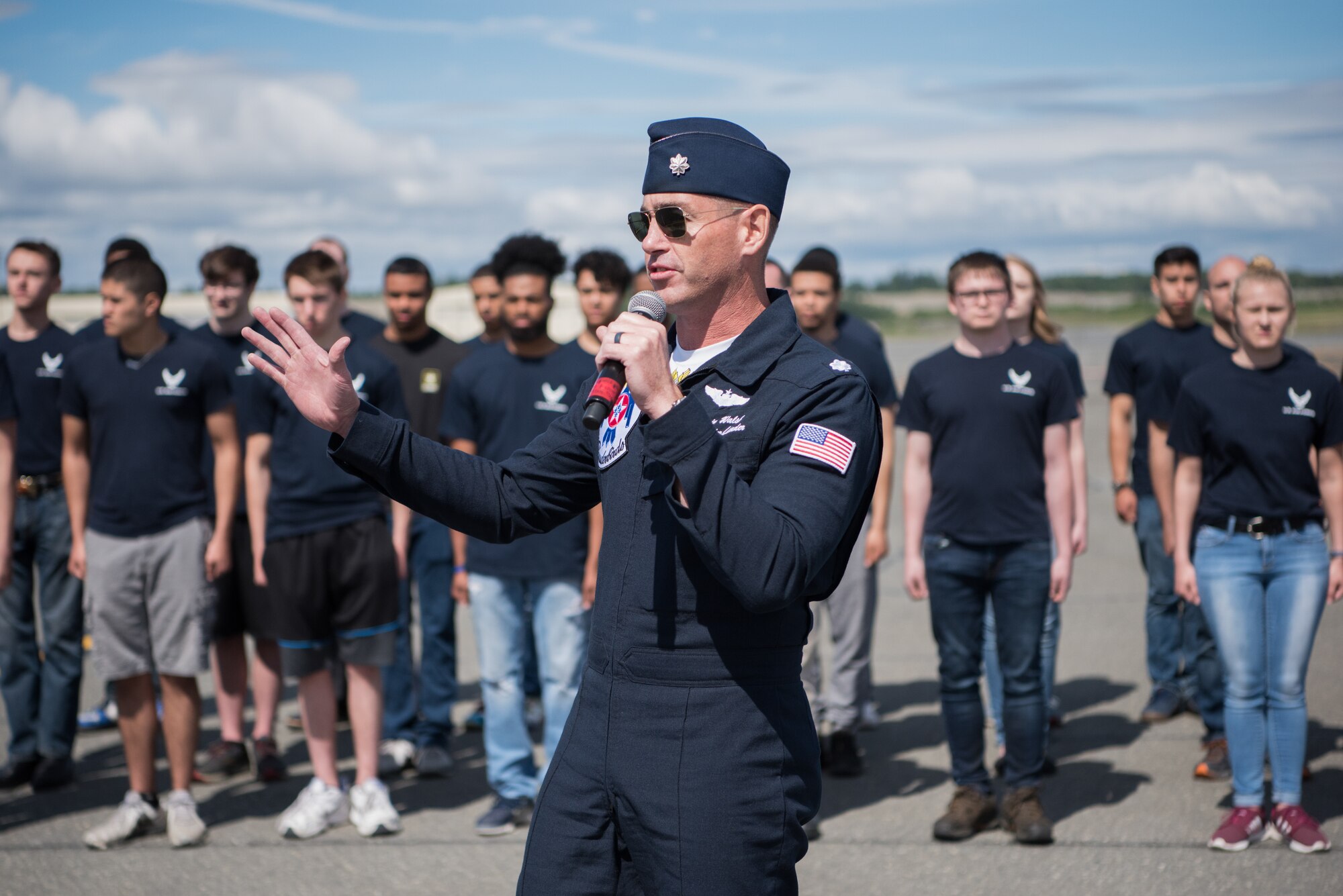 Lt. Col. Kevin Walsh, Thunderbirds Commander/Leader talks to the crowd during the Arctic Thunder Open House June 30, 2018. This biennial event hosted by Joint Base Elmendorf-Richardson, Alaska, is one of the largest in the state and one of the premier aerial demonstrations in the world. The event features multiple performers and ground acts to include the JBER joint forces, U.S. Air Force F-22, and U.S. Air Force Thunderbirds demonstrations teams, June 30-July 1.