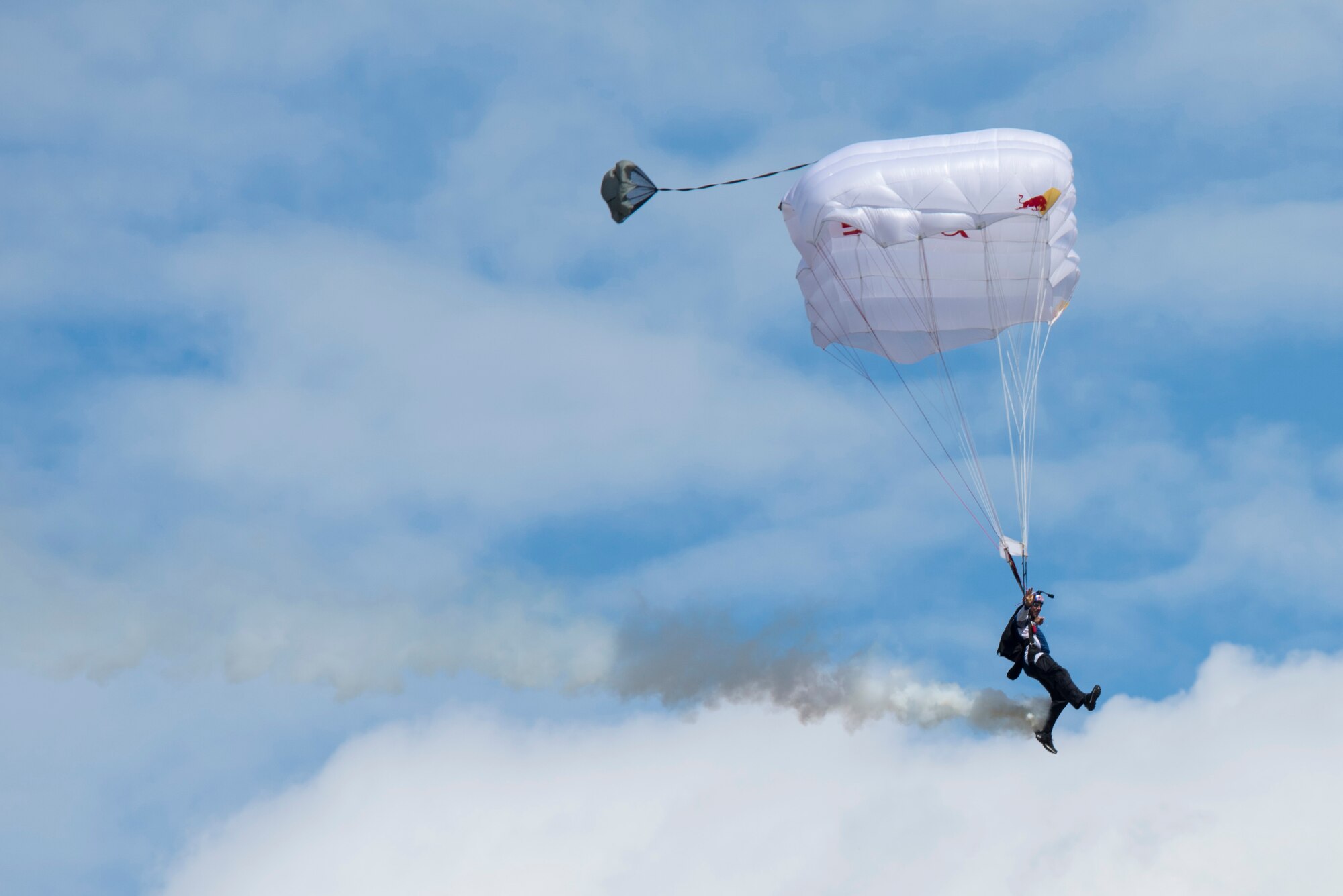 Red Bull Air Force member Miles Daisher, skydives during the Arctic Thunder Open House at Joint Base Elmendorf-Richardson, Alaska, June 30, 2018. During the biennial open house, JBER opens its gates to the public and hosts multiple performers including the U.S. Air Force Thunderbirds, JBER Joint Forces Demonstration and the U.S. Air Force F-22 Raptor Demonstration Team.
