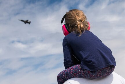 Spectators watch an air demonstration during the Arctic Thunder Open House June 30, 2018. This biennial event hosted by Joint Base Elmendorf-Richardson, Alaska, is one of the largest in the state and one of the premier aerial demonstrations in the world. The event features multiple performers and ground acts to include the JBER joint forces, U.S. Air Force F-22, and U.S. Air Force Thunderbirds demonstrations teams, June 30-July 1.