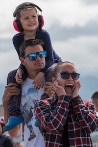 Spectators watch an air demonstration during the Arctic Thunder Open House June 30, 2018. This biennial event hosted by Joint Base Elmendorf-Richardson, Alaska, is one of the largest in the state and one of the premier aerial demonstrations in the world. The event features multiple performers and ground acts to include the JBER joint forces, U.S. Air Force F-22, and U.S. Air Force Thunderbirds demonstrations teams, June 30-July 1.