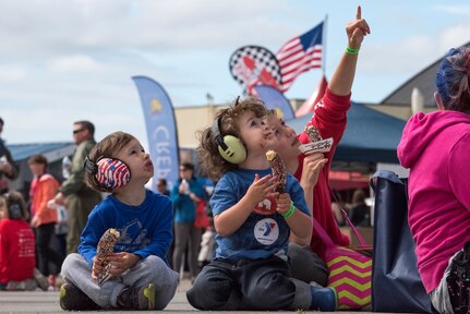 Spectators watch an air demonstration during the Arctic Thunder Open House June 30, 2018. This biennial event hosted by Joint Base Elmendorf-Richardson, Alaska, is one of the largest in the state and one of the premier aerial demonstrations in the world. The event features multiple performers and ground acts to include the JBER joint forces, U.S. Air Force F-22, and U.S. Air Force Thunderbirds demonstrations teams, June 30-July 1.