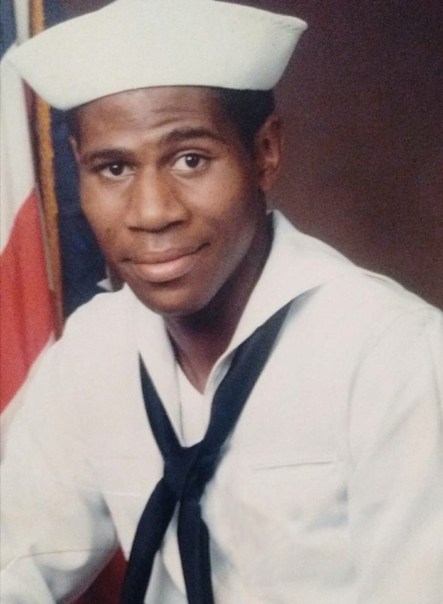 Recruit Martez D. Banks poses for a photo, wearing his dress white uniform, during Navy Boot Camp in 1986.