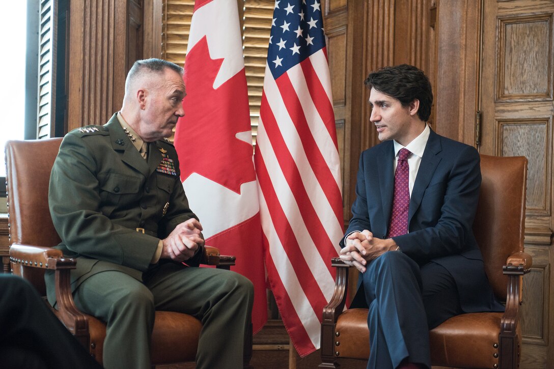 Marine Corps Gen. Joe Dunford,speaks with Canadian Prime Minister Justin Trudeau.
